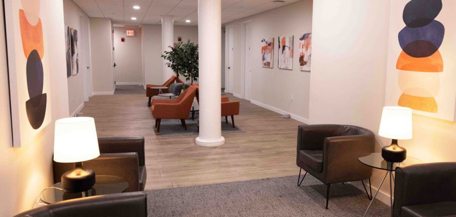 Resilient Self Therapy - A hallway with chairs lamps and paintings on the walls in Union Square, New York City